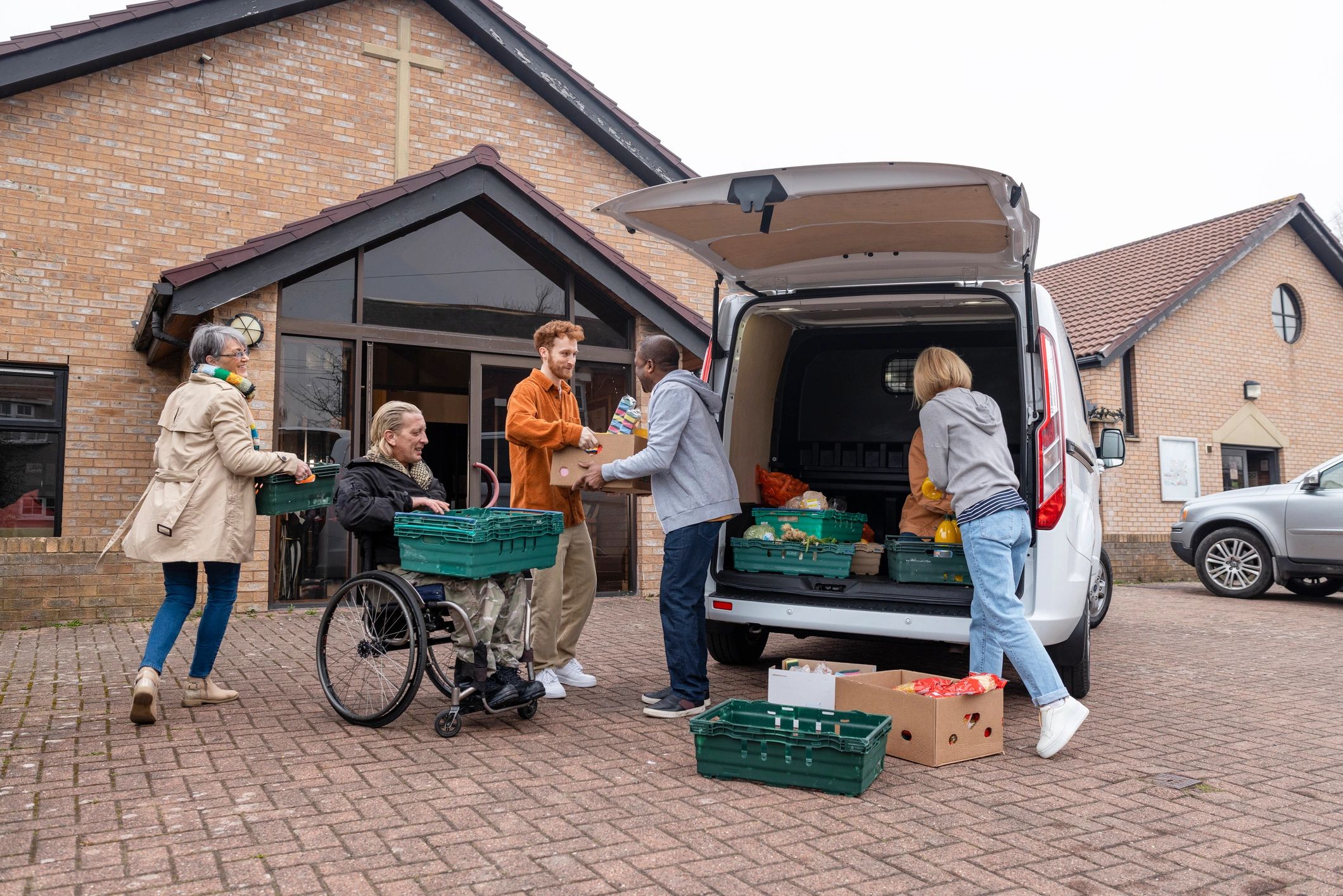Volunteers unloading food donations for community relief